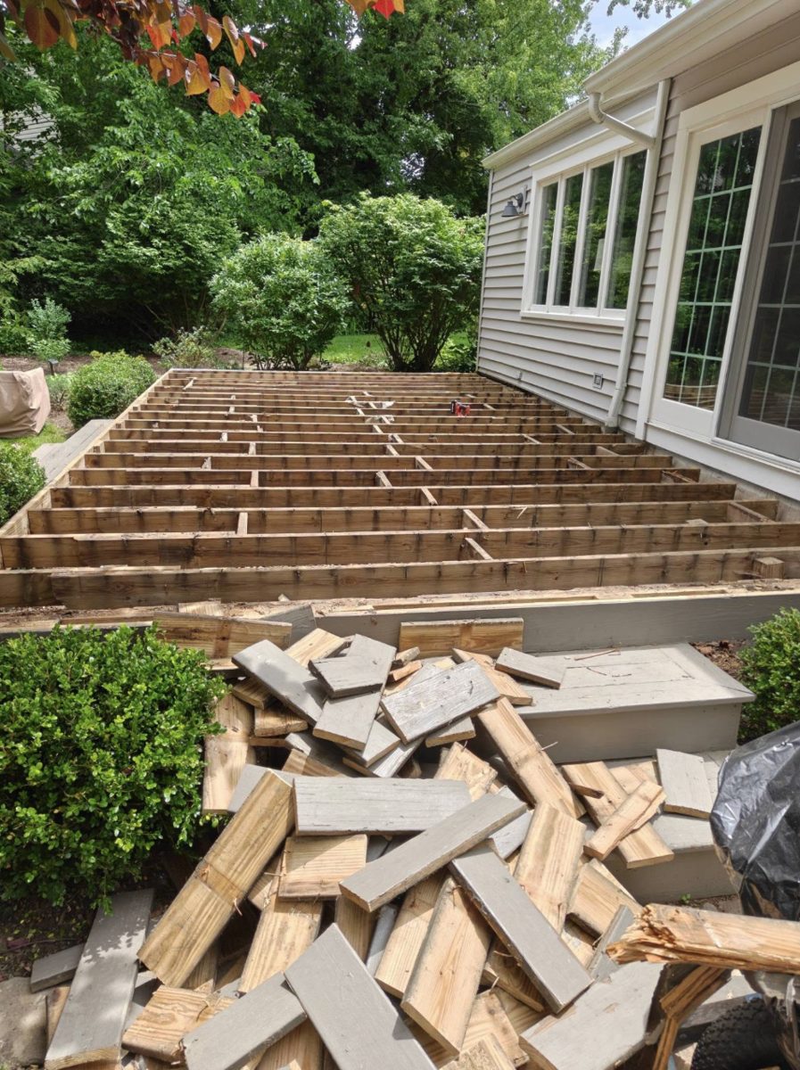 Old deck boards torn off and new joist framing in place